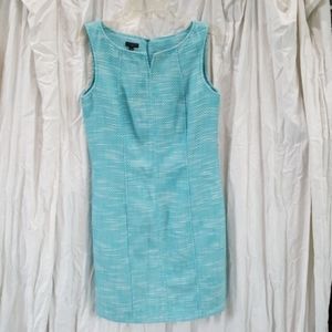 Turquoise and white dress.